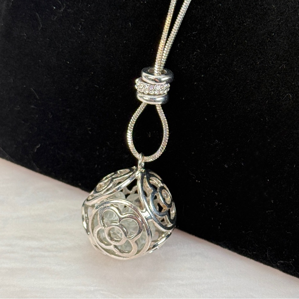Silvertone with bling, long layering filled ball pendant necklace